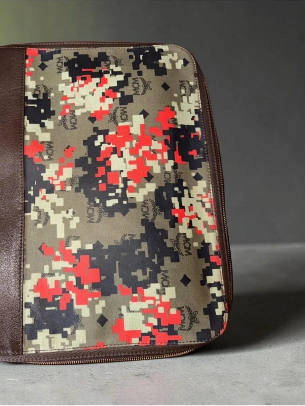 MCM laptop portfolio with brown leather trim and digital camo fabric